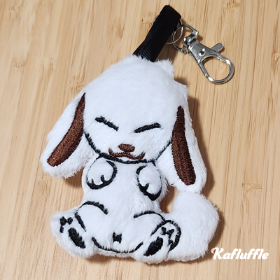 A white dog plush keychain