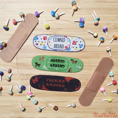 Three transparent banaid themed stickers