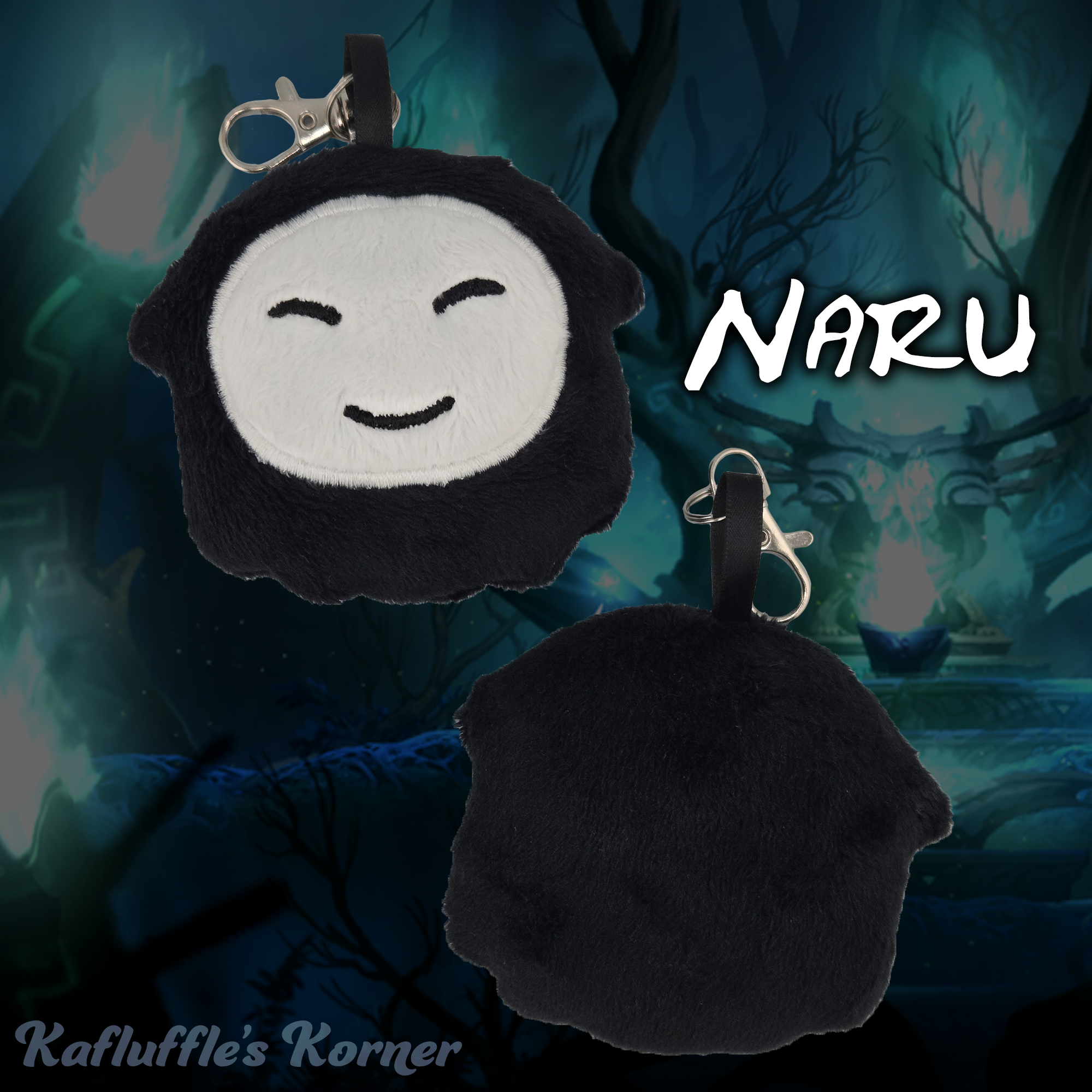 Plush keychain of a black creature with a white face.