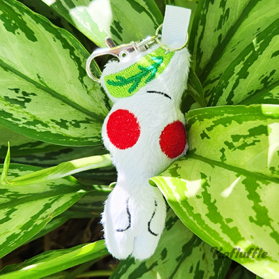 Plush keychain of white pikmin