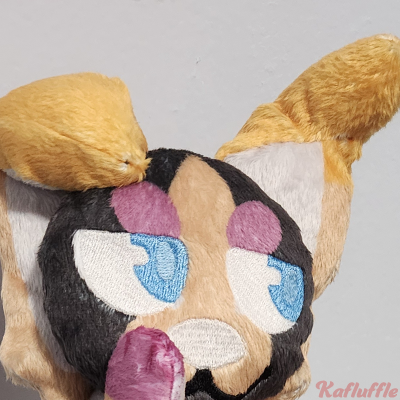 A Halloween themed dog plush